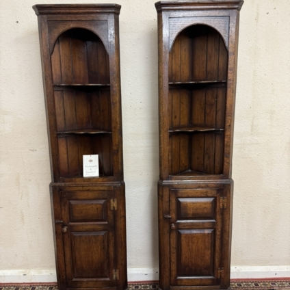 A PAIR OF QUALITY OAK TITCHMARSH AND GOOWIN CORNER CUPBOARDS