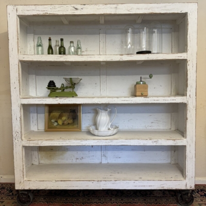 LARGE FRENCH RUSTIC OPEN SHELVING ON IRON INDUSTRIAL WHEELS